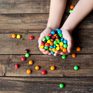 'child holding candy'